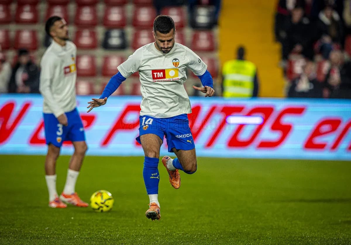 Jugadores de Valencia calentando antes del partido