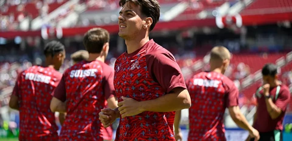 Jugadores suizos calentando antes del partido