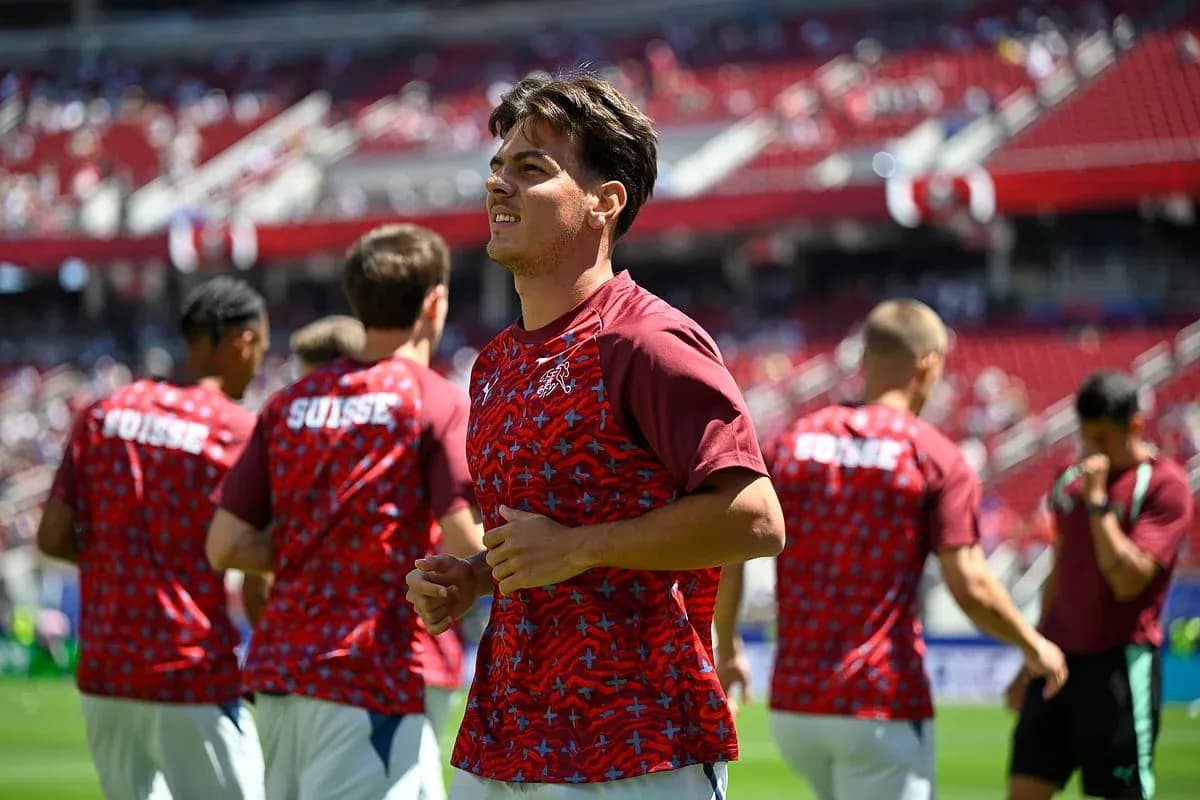Jugadores suizos calentando antes del partido