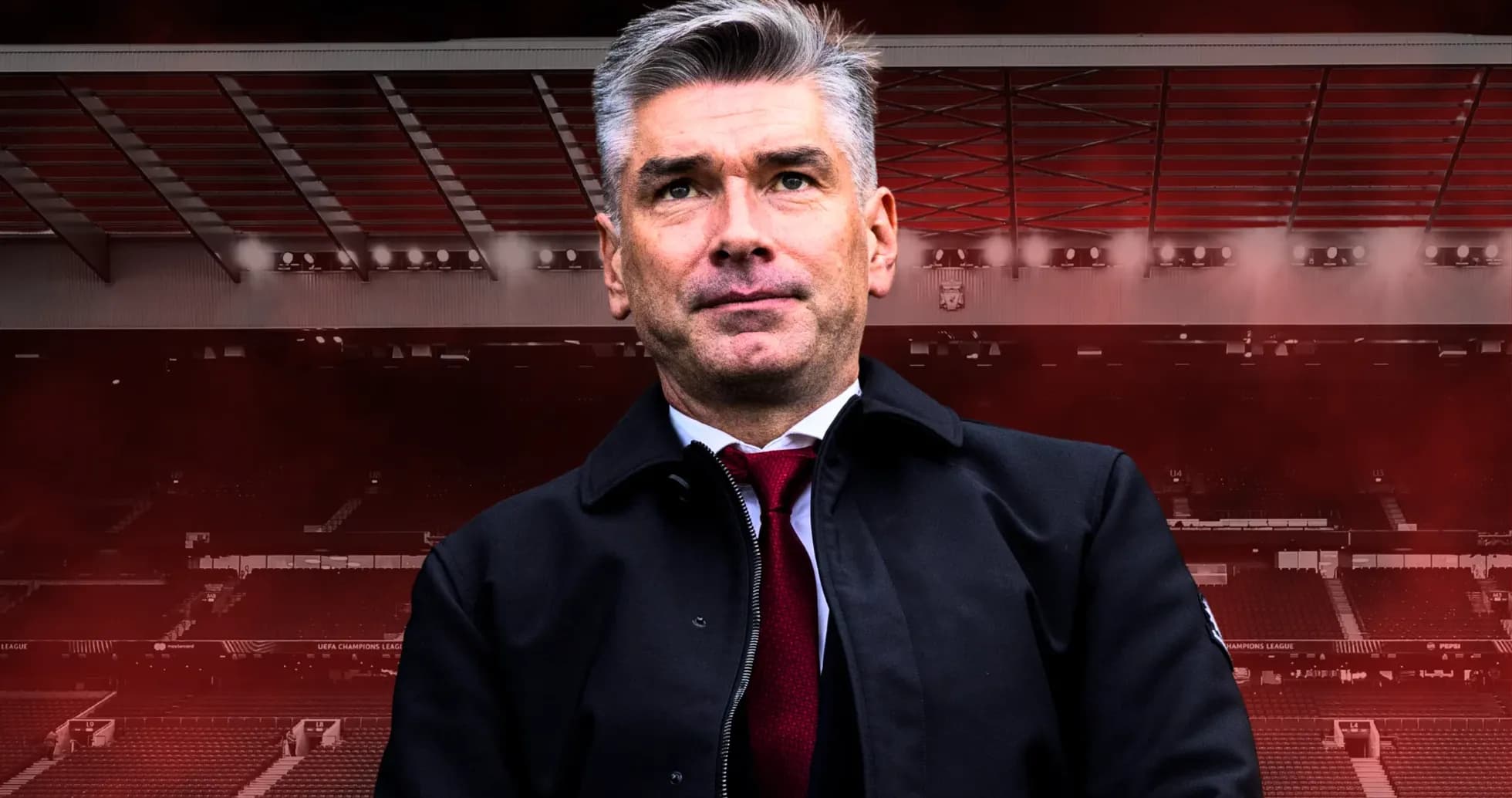Entrenador posando frente a un estadio de fútbol